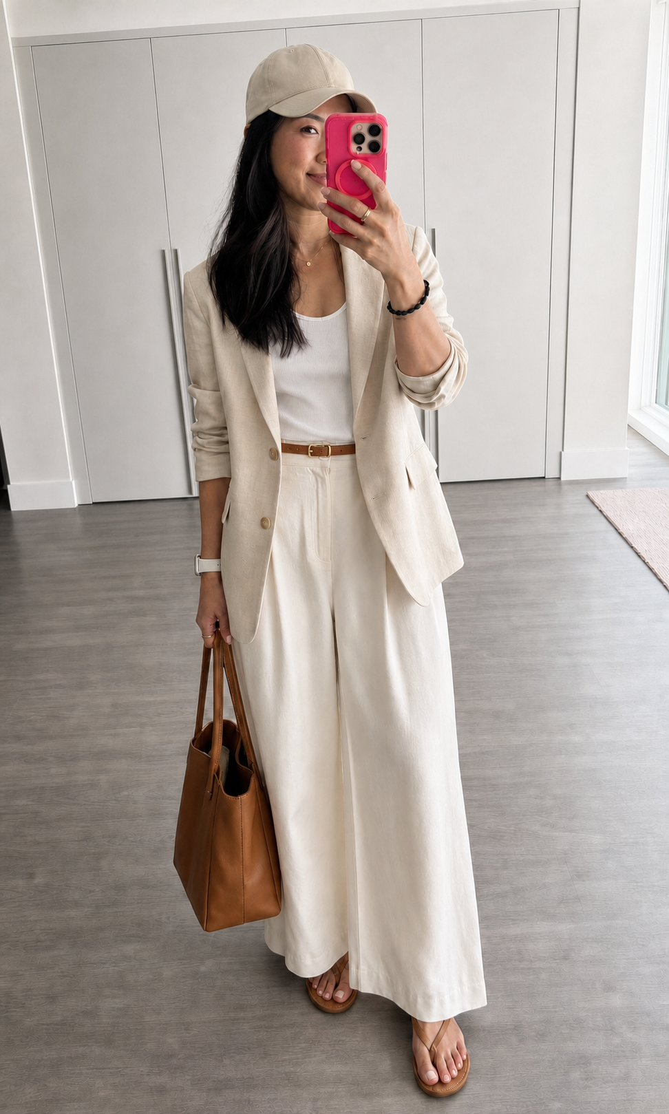 Cream blazer, white tank, ivory trousers, cognac belt and tote